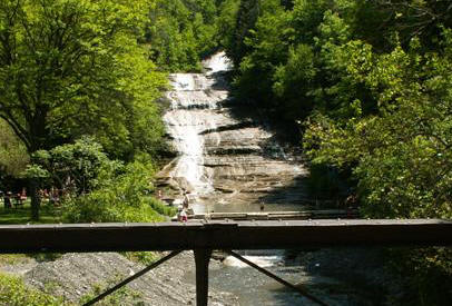 View on bridge showing Buttermilk Falls in background.